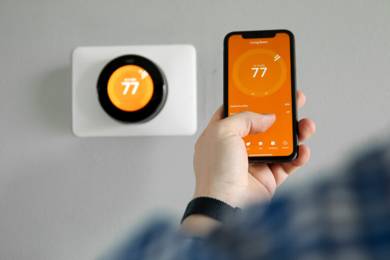 changing smart thermostat with mobile phone
